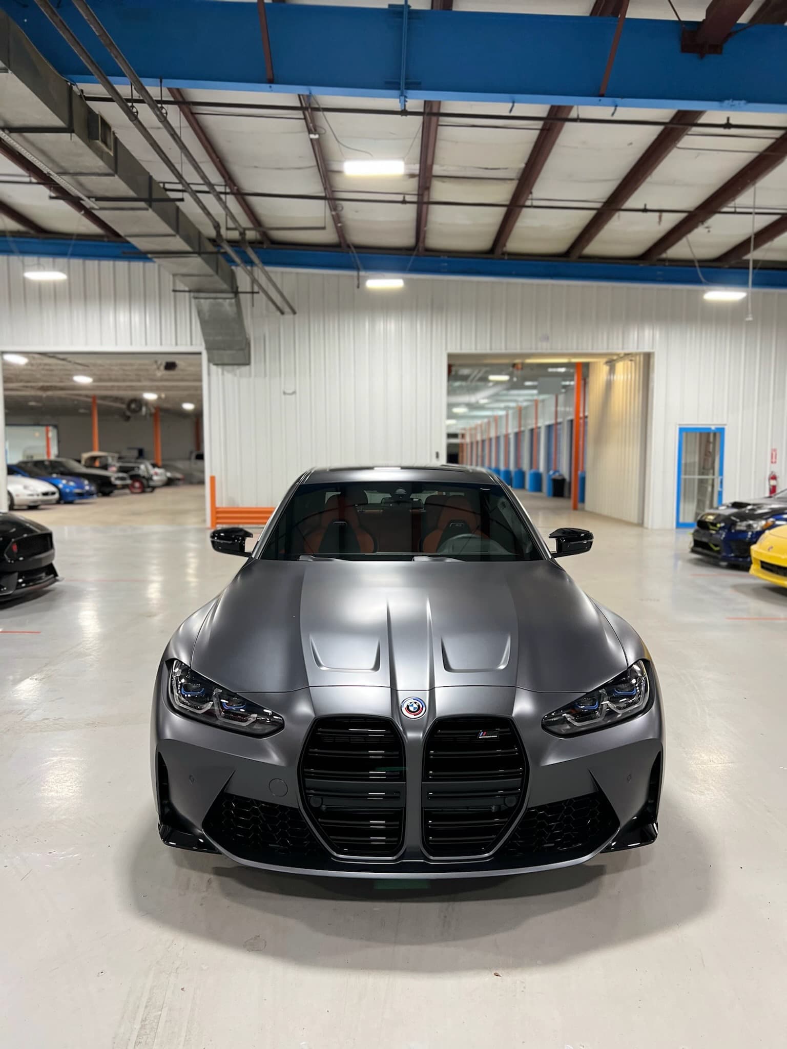 A BMW M4 parked indoors